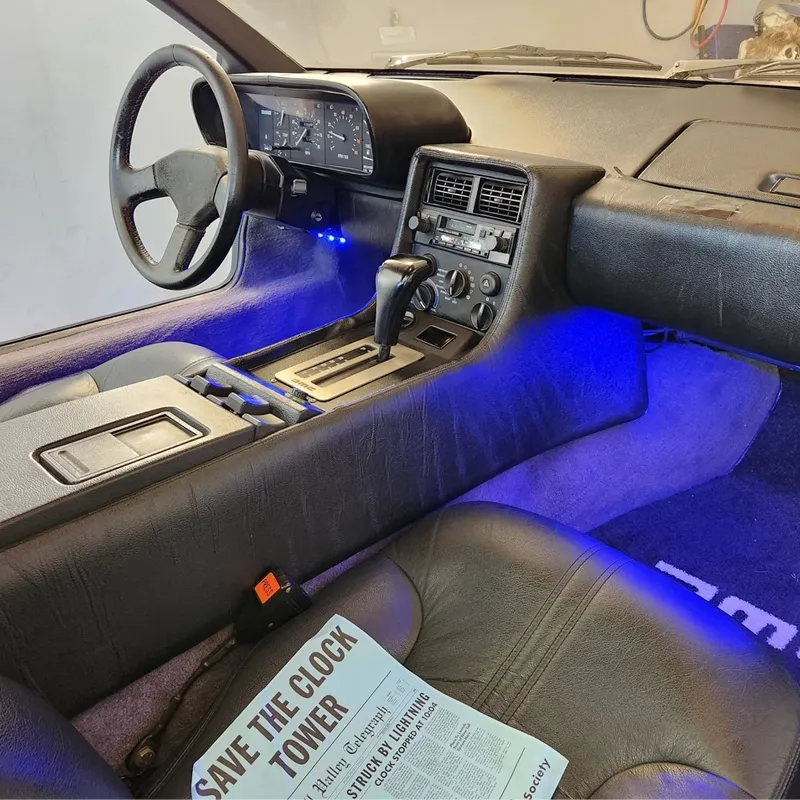 DeLorean DMC-12 displayed outdoors at an event